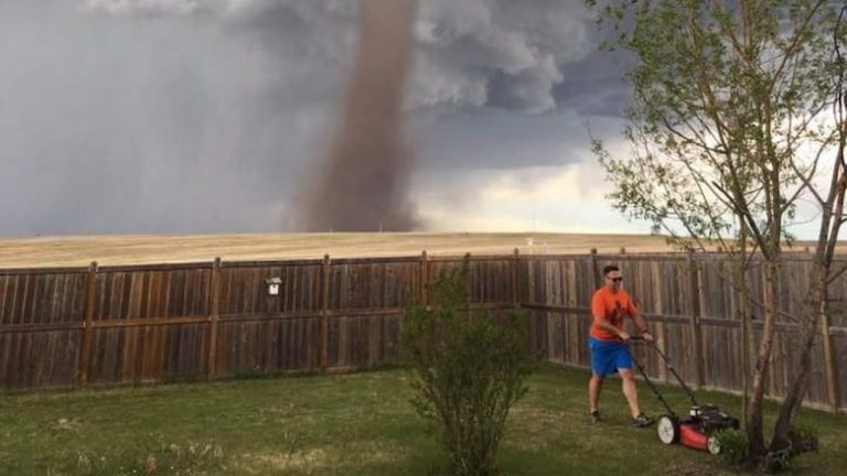 Why The “Man Mowing Lawn in Tornado” Meme Perfectly Captures The Spirit Of Ignoring Life’s Chaos